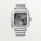 ساعة Santos de Cartier Dual Time كبيرة الحجم 40.2 مم، مصنوعة من الفولاذ، تاج أزرق، ميناء رمادي أنثراسيت، سوار فولاذي، حركة أوتوماتيكية
