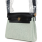 حقيبة Herbag Zip 20 ميني بلون إيكرو وأخضر موين من قماش Toile H وجلد Vache Hunter الأسود مع قطع معدنية من ذهب