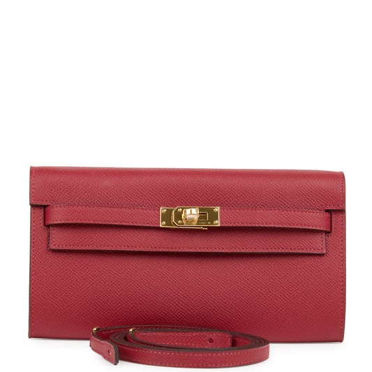 محفظة كيلي تو جو (Kelly Wallet To Go) باللون الأحمر الرمان (Rouge Grenat) من جلد إبسوم مع قطع معدنية من ذهب
