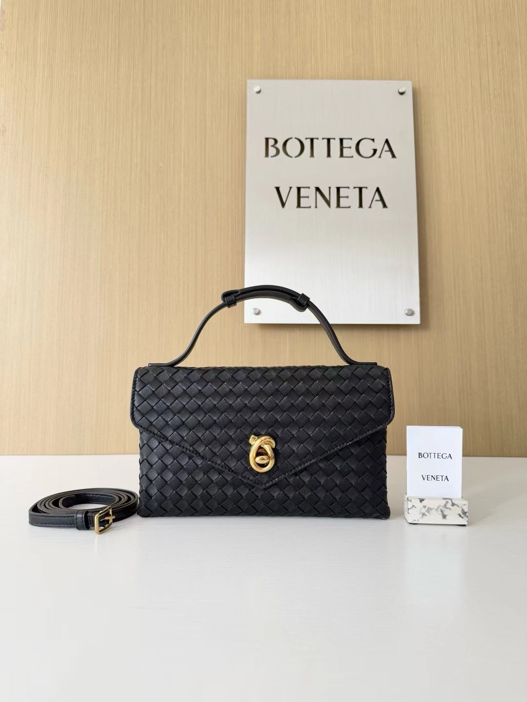 Structured Woven Clutch Bag with Top Handle and Gold Clasp
